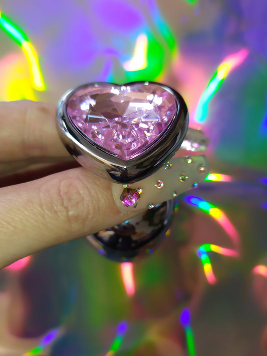 Heart shaped pink jewel butt plug. Black or silver stainless steel butt plug. 
