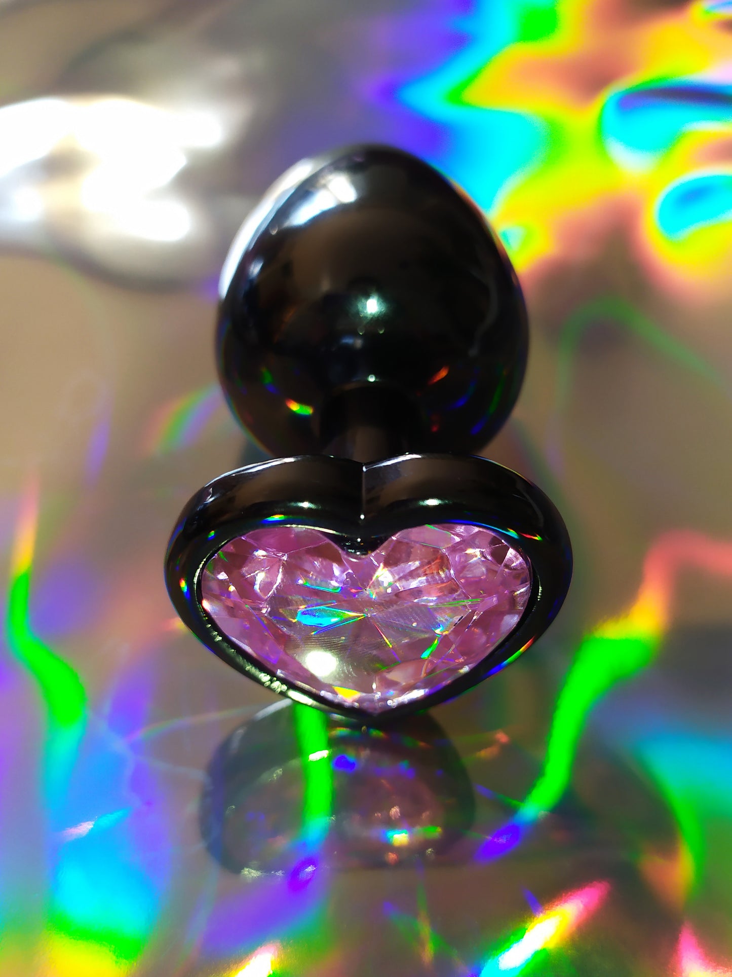 Heart shaped pink jewel butt plug. Black or silver stainless steel butt plug.