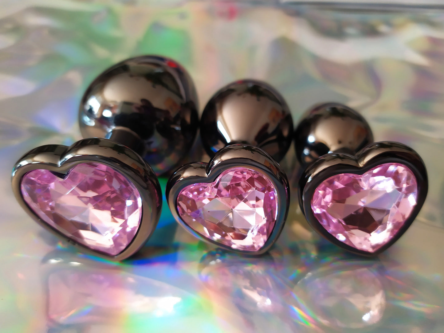 Heart shaped pink jewel butt plug. Black or silver stainless steel butt plug.