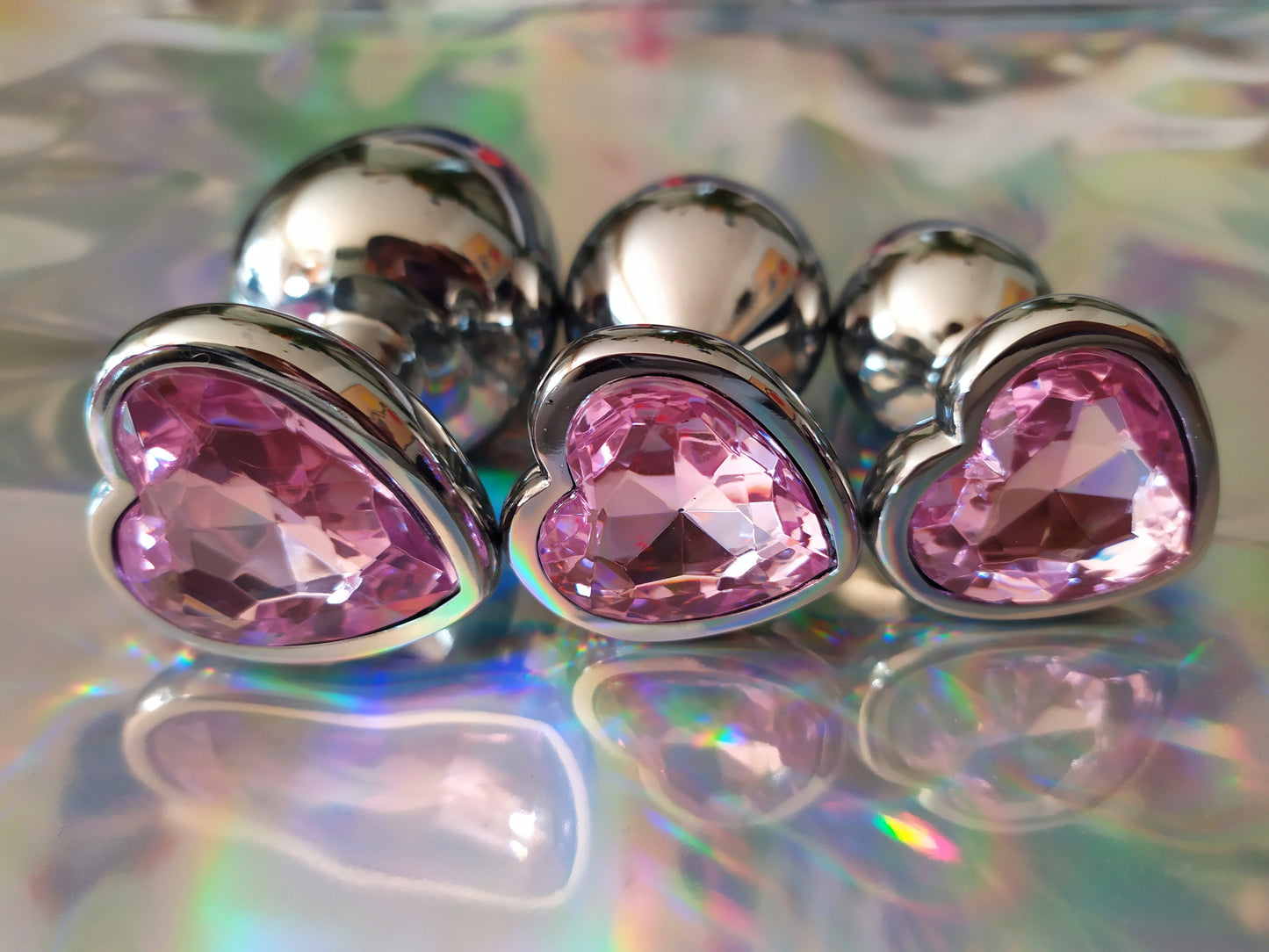 Heart shaped pink jewel butt plug. Black or silver stainless steel butt plug.