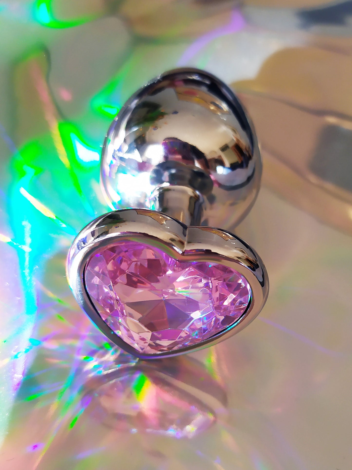 Heart shaped pink jewel butt plug. Black or silver stainless steel butt plug.
