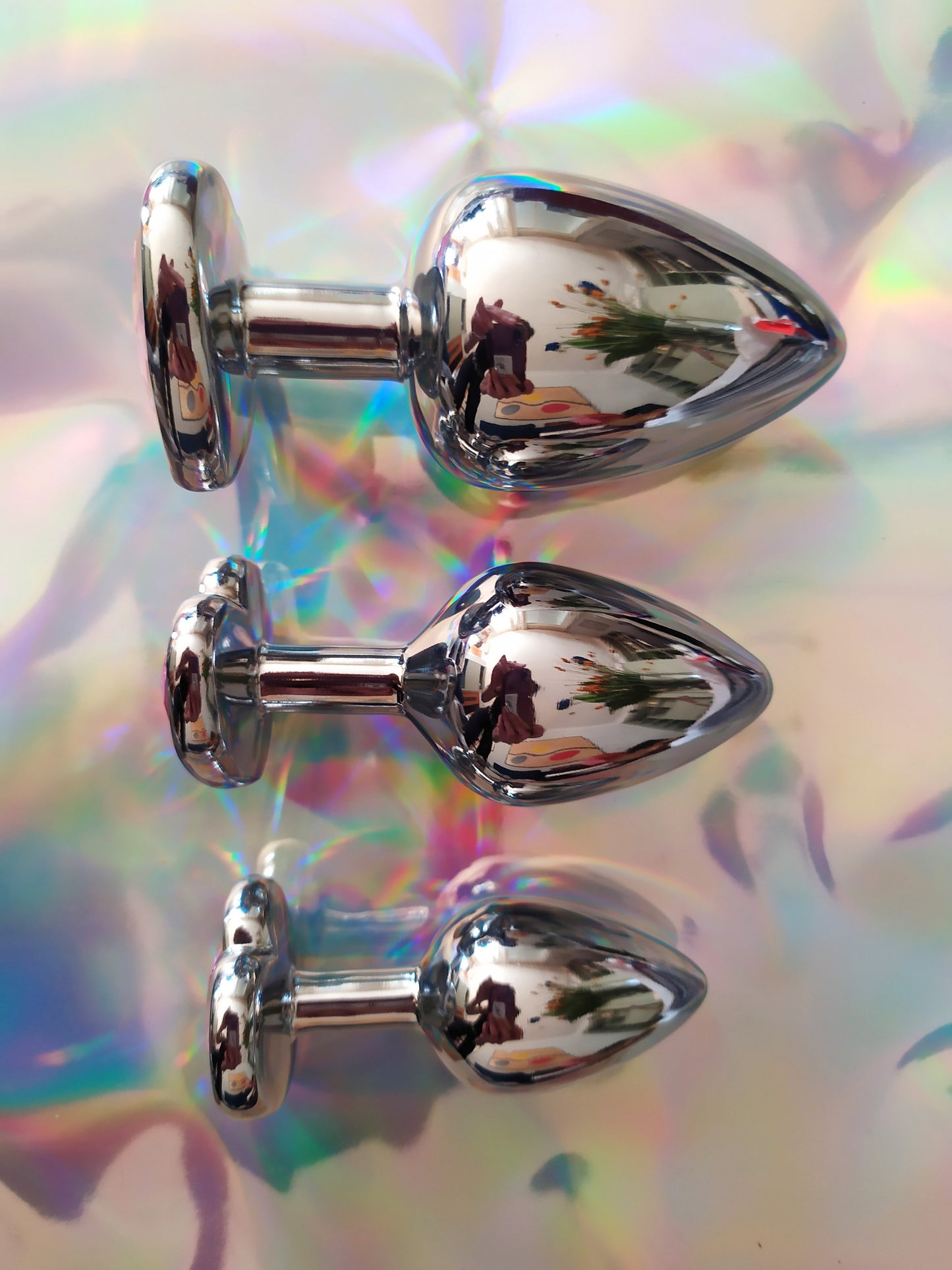 Heart shaped pink jewel butt plug. Black or silver stainless steel butt plug.