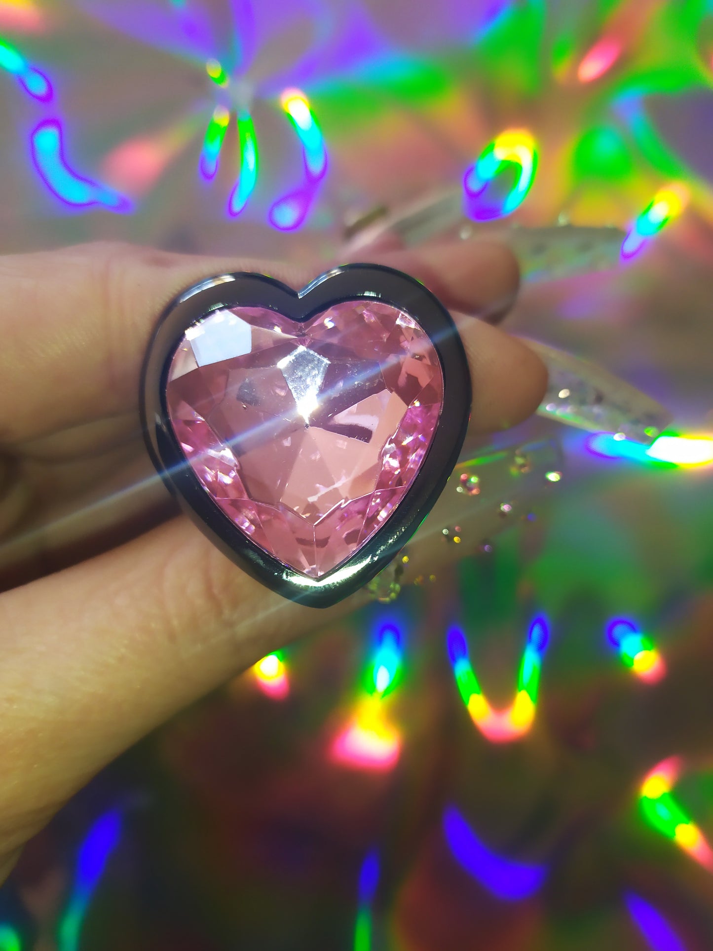 Heart shaped pink jewel butt plug. Black or silver stainless steel butt plug.