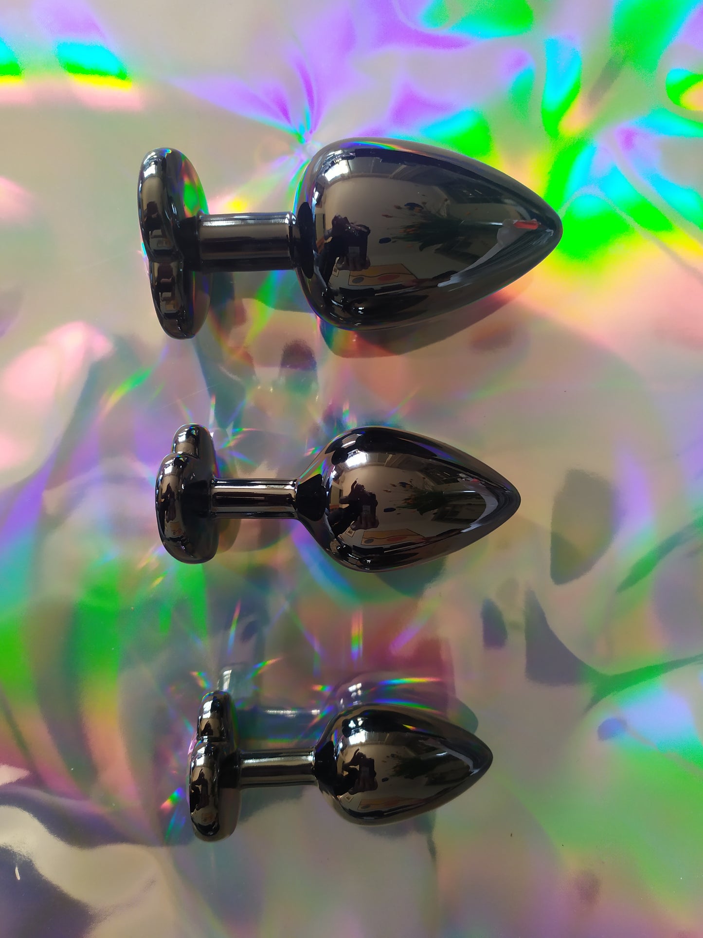 Heart shaped pink jewel butt plug. Black or silver stainless steel butt plug.