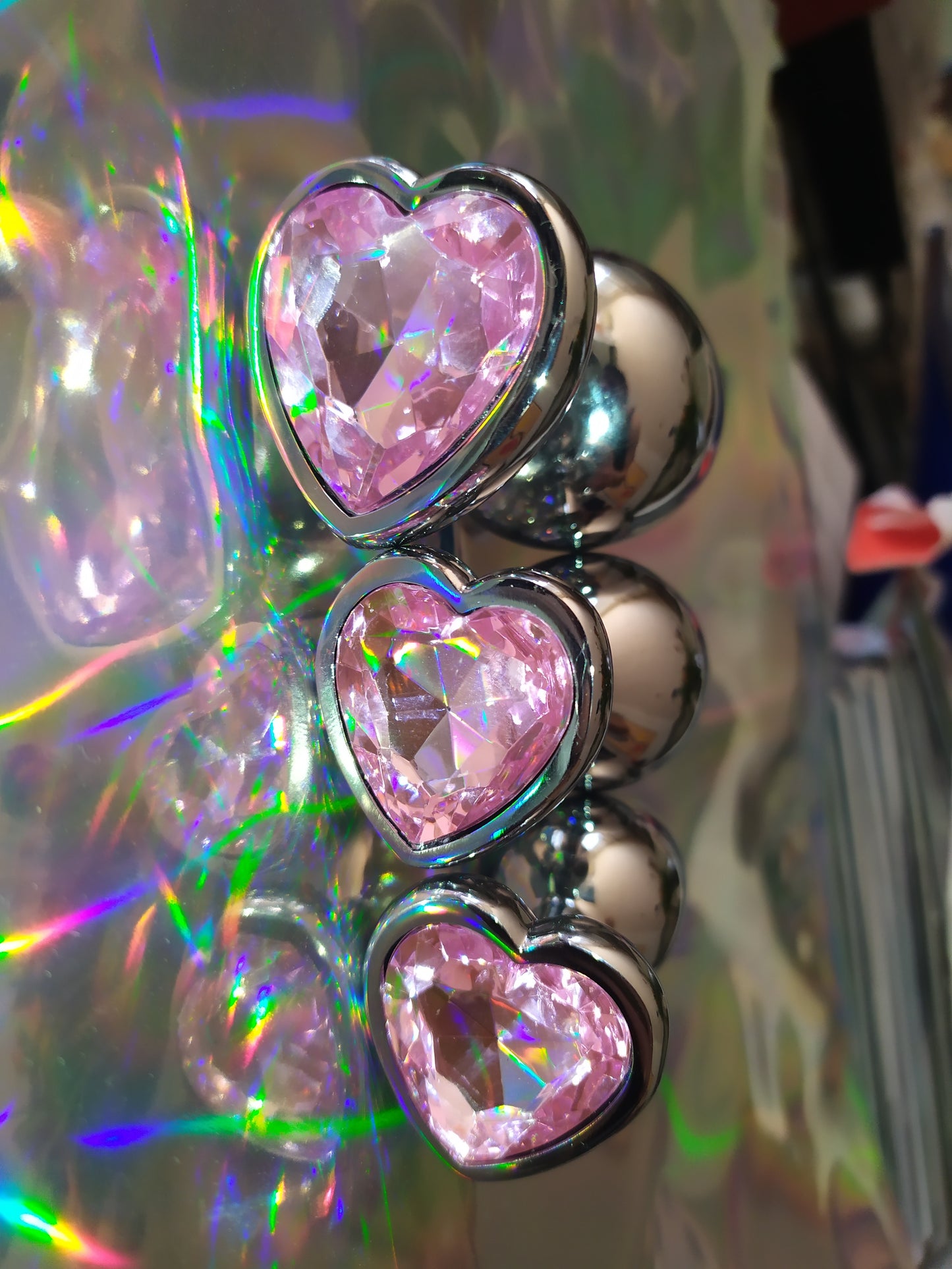 Heart shaped pink jewel butt plug. Black or silver stainless steel butt plug.