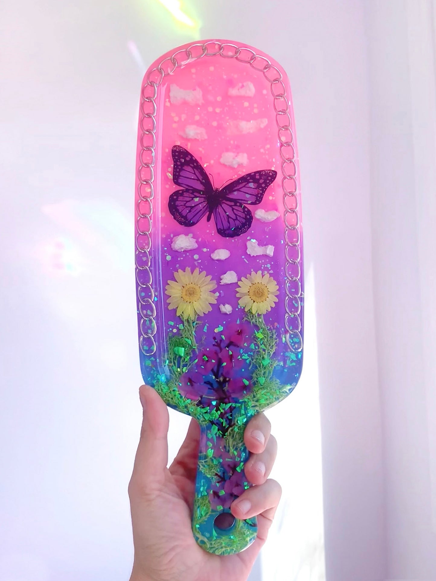 Nature inspired pink resin spanking paddle with butterfly, clouds and flowers