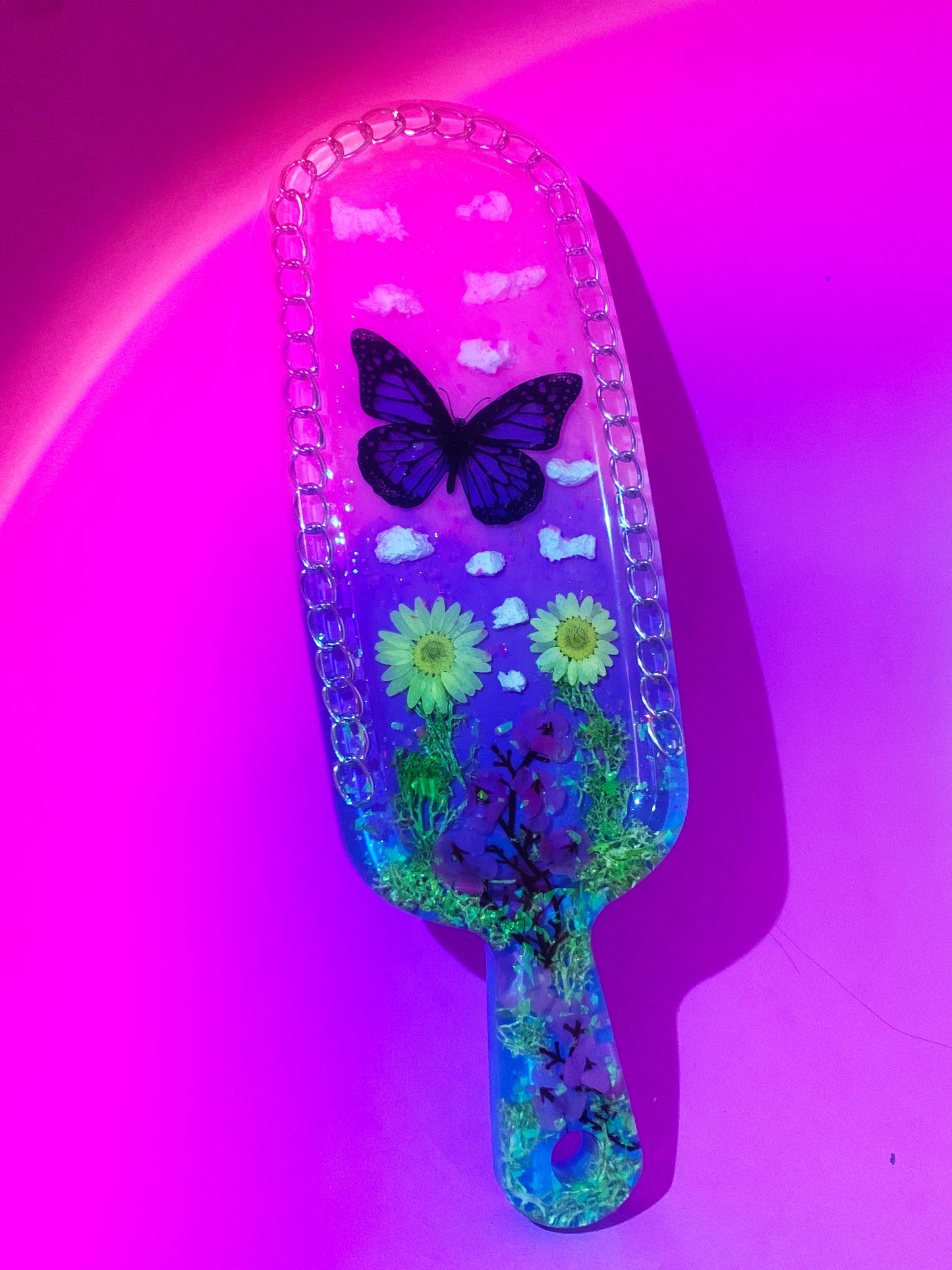 Nature inspired pink resin spanking paddle with butterfly, clouds and flowers