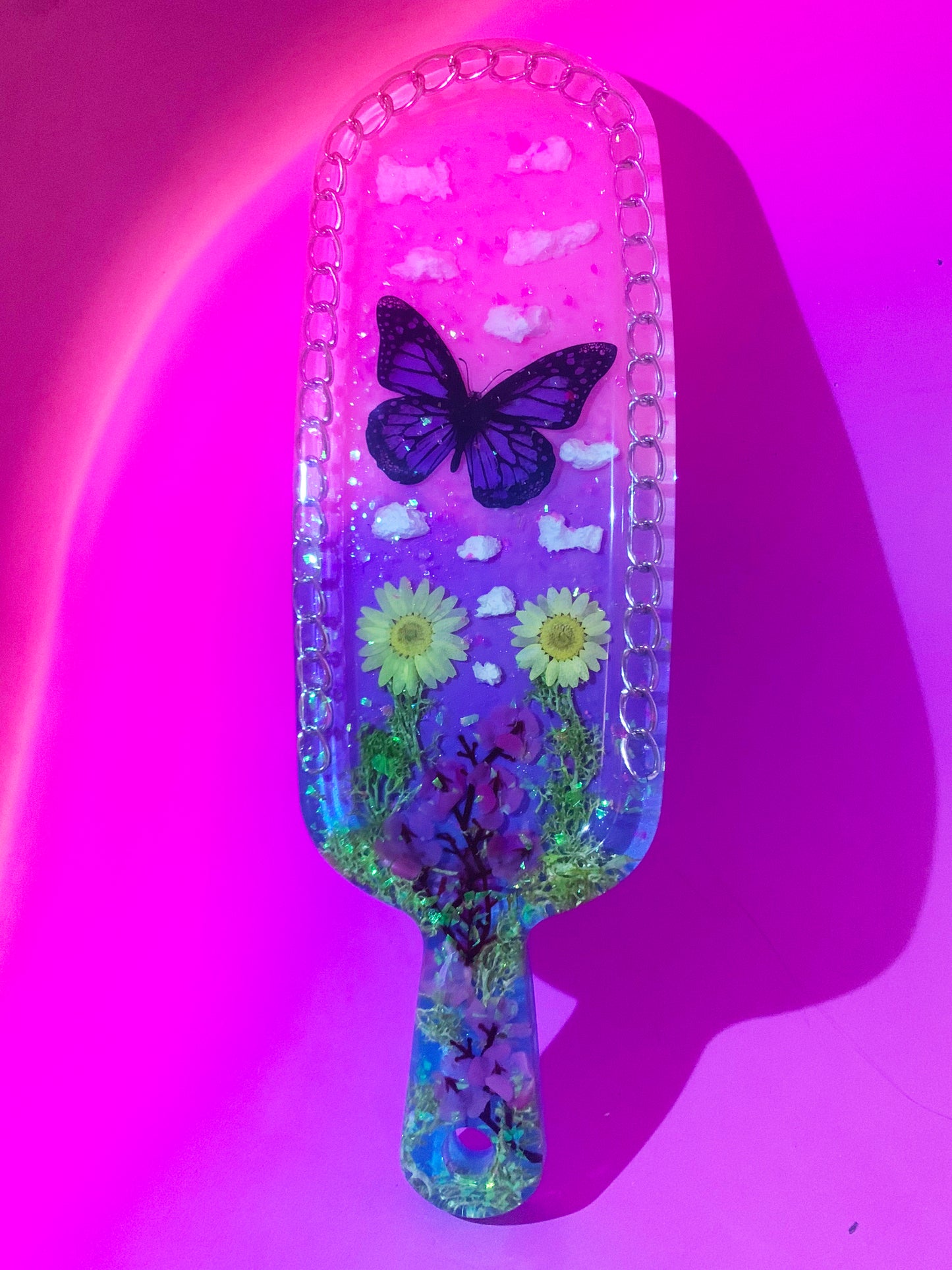Nature inspired pink resin spanking paddle with butterfly, clouds and flowers