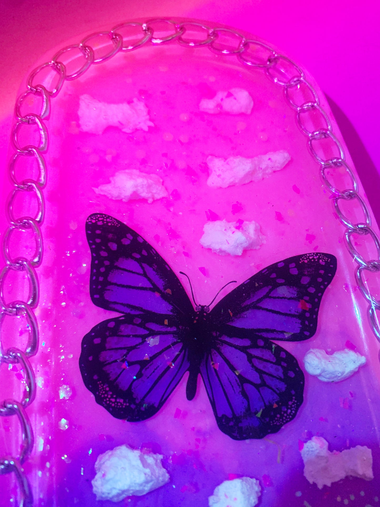 Nature inspired pink resin spanking paddle with butterfly, clouds and flowers
