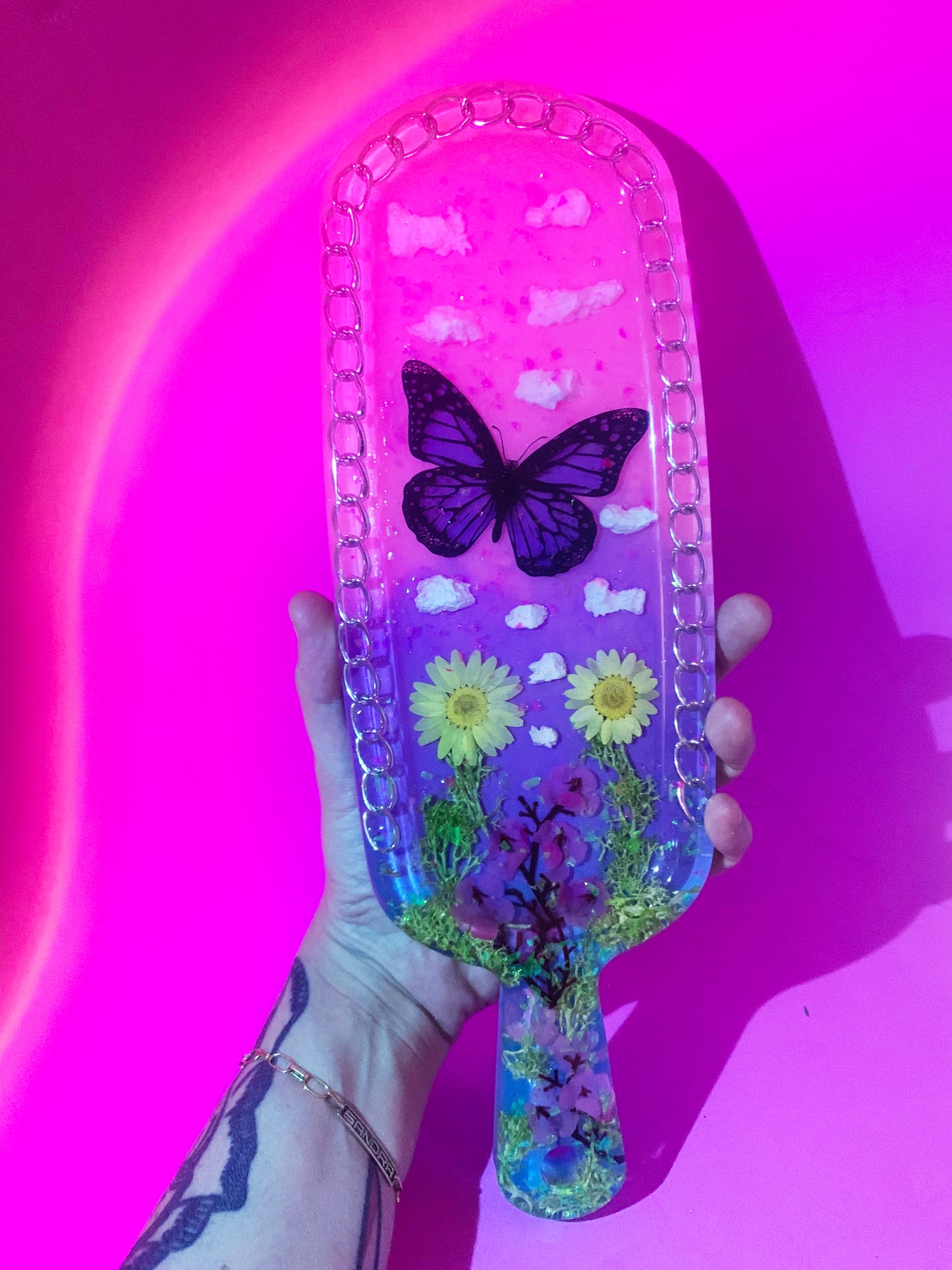 Nature inspired pink resin spanking paddle with butterfly, clouds and flowers
