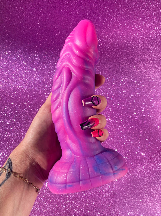 Pink glitter fantasy dildo with strong suction cup made of silicone