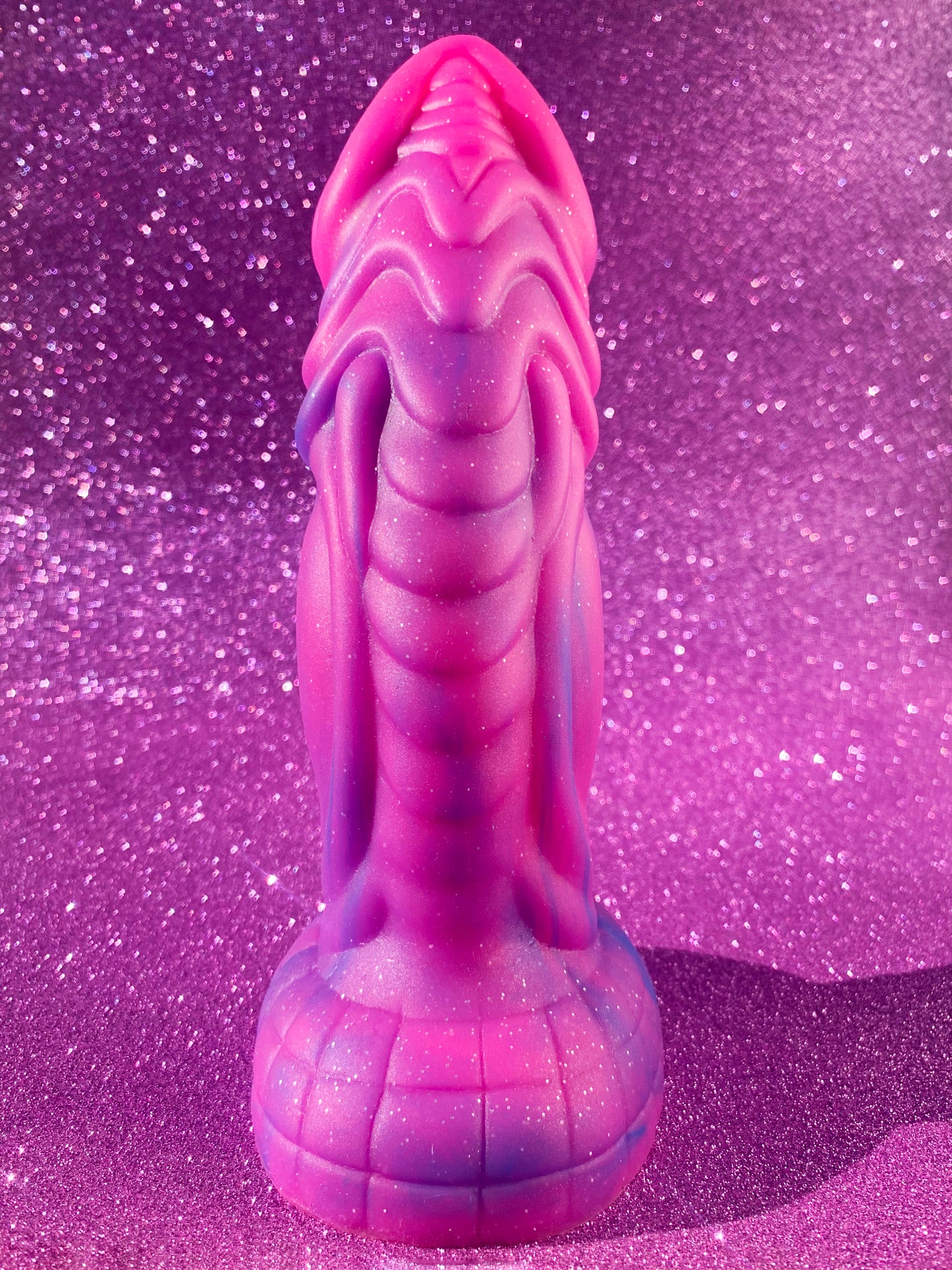 Pink glitter fantasy dildo with strong suction cup made of silicone