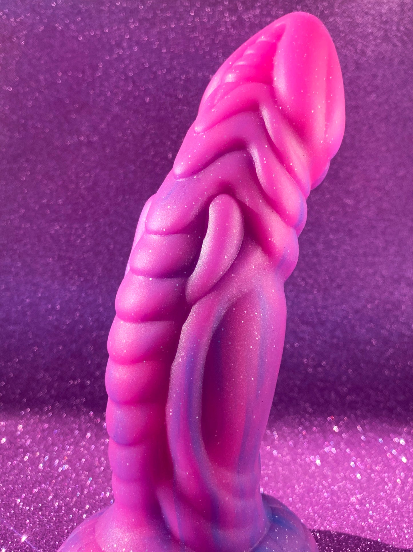 Pink glitter fantasy dildo with strong suction cup made of silicone