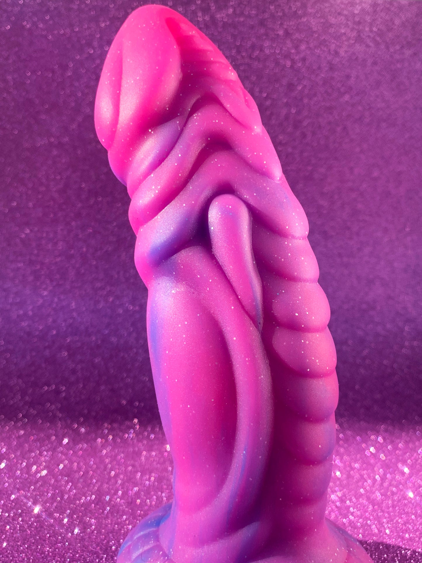 Pink glitter fantasy dildo with strong suction cup made of silicone