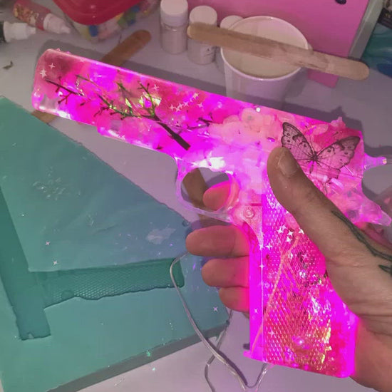 Custom pink resin gun lamp with flowers and glitter