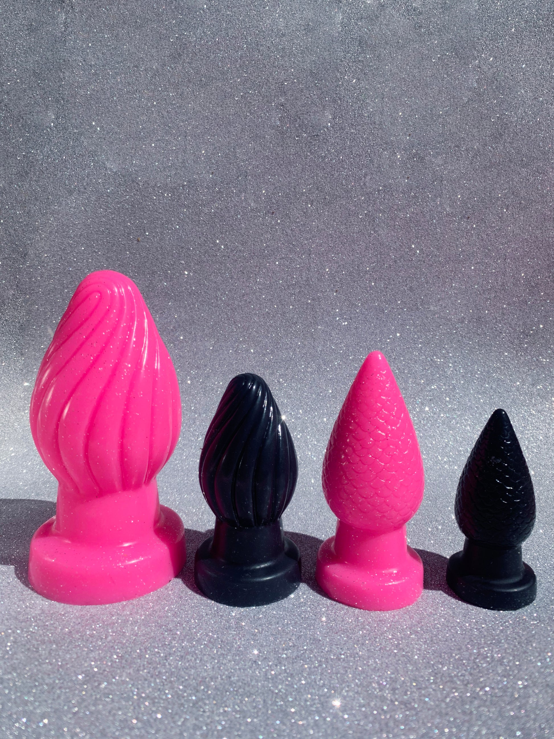 Big pink and black fantasy silicone butt plugs