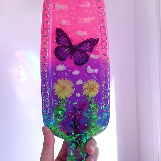 Nature inspired pink resin spanking paddle with butterfly, clouds and flowers 