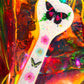 Heart shaped resin spanking paddle made of resin, flowers, butterflies and glitter