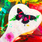 Heart shaped resin spanking paddle made of resin, flowers, butterflies and glitter