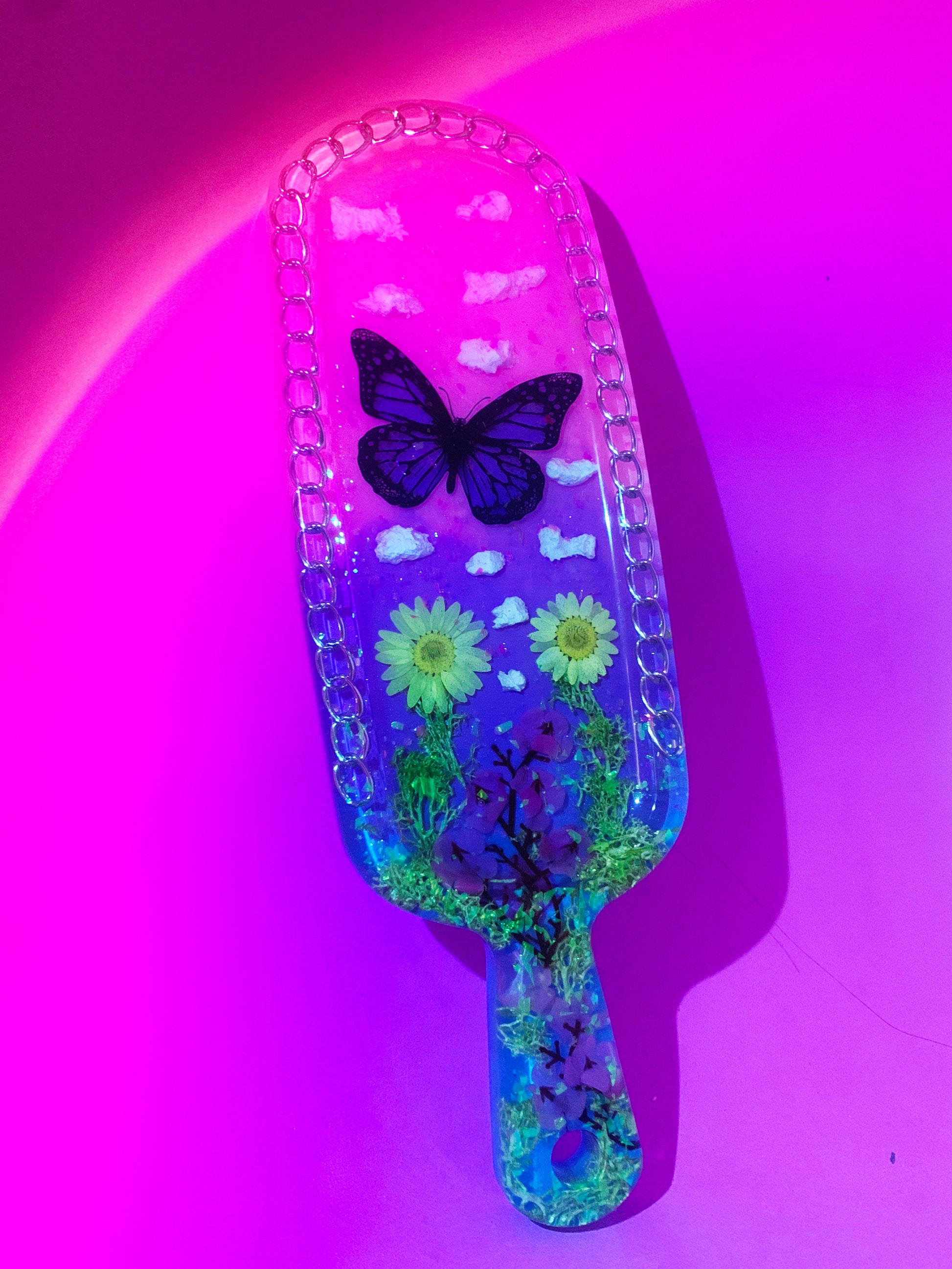 Nature inspired pink resin spanking paddle with butterfly, clouds and flowers 