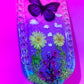 Nature inspired pink resin spanking paddle with butterfly, clouds and flowers 