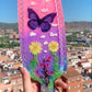 Nature inspired pink resin spanking paddle with butterfly, clouds and flowers 