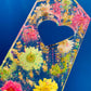 Resin spanking paddle with dried flowers, gold flakes and glitter holographic paper