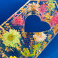Resin spanking paddle with dried flowers, gold flakes and glitter holographic paper