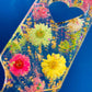 Resin spanking paddle with dried flowers, gold flakes and glitter holographic paper